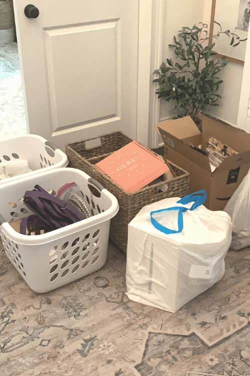 donations from decluttering in hallway