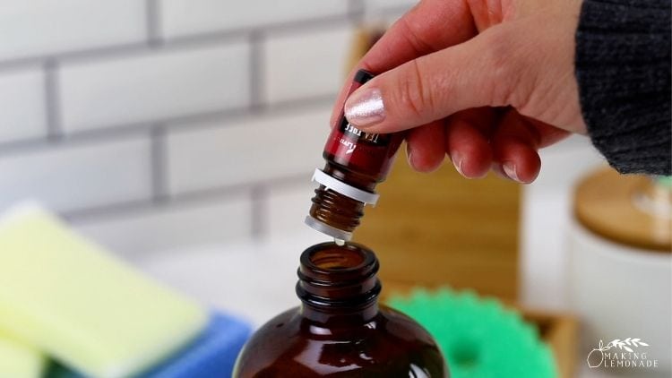 adding essential oils to bottle