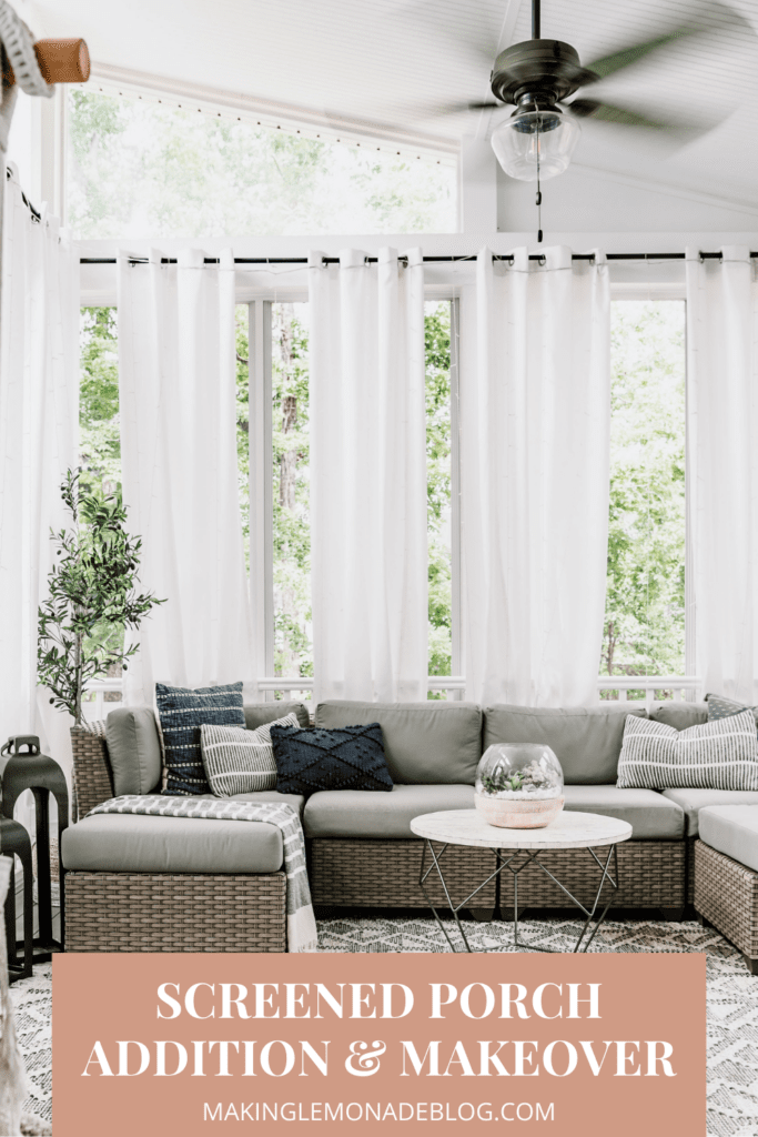 screened porch with sectional and curtains