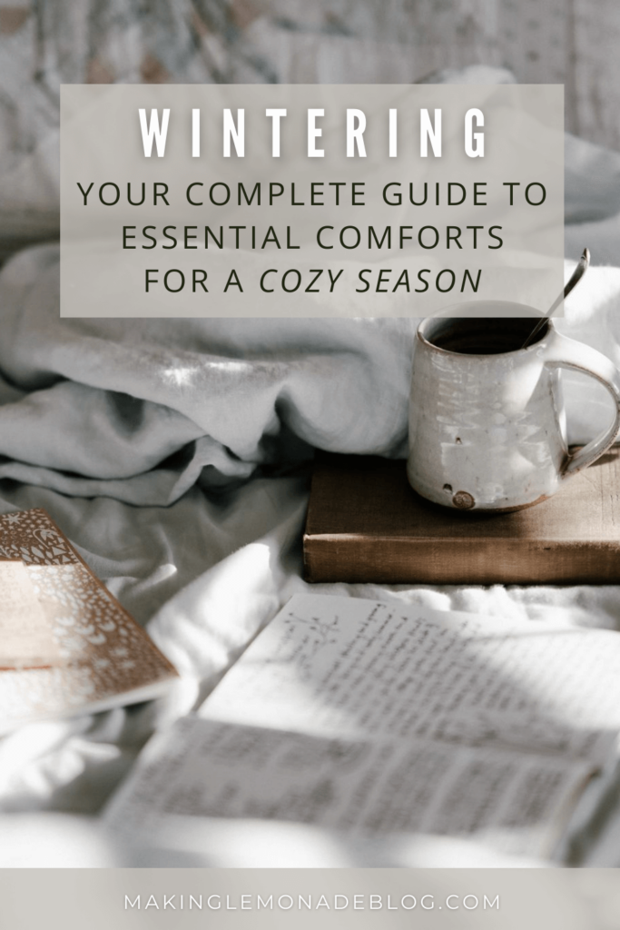 coffee and journal with text that reads: 'wintering: your complete guide to essential comforts for a cozy season'