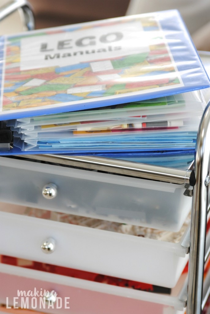 An organized binder full of LEGO manuals