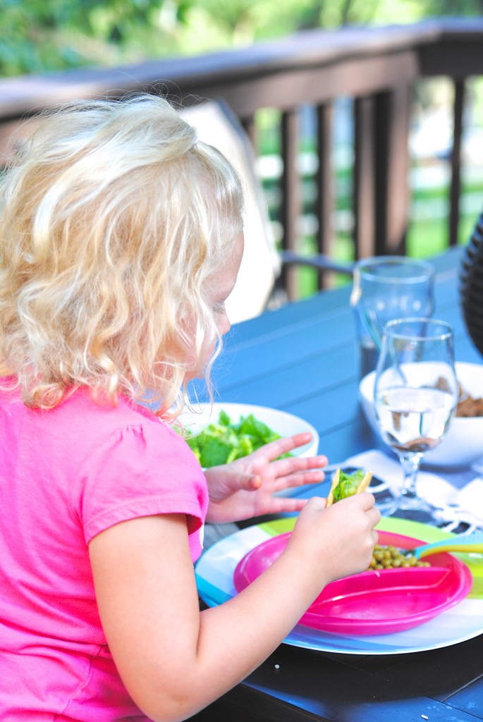 A child eating at a picnic table