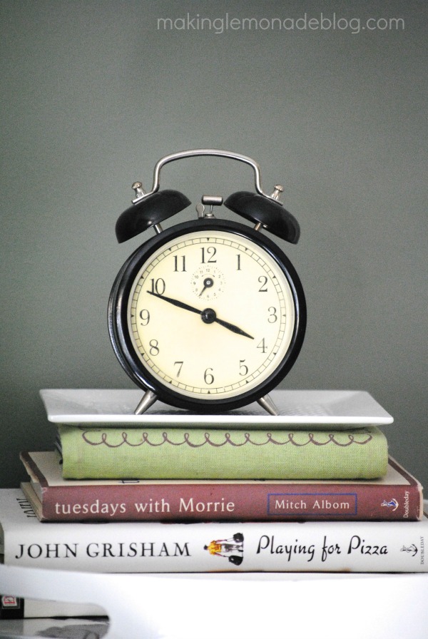 alarm clock and books