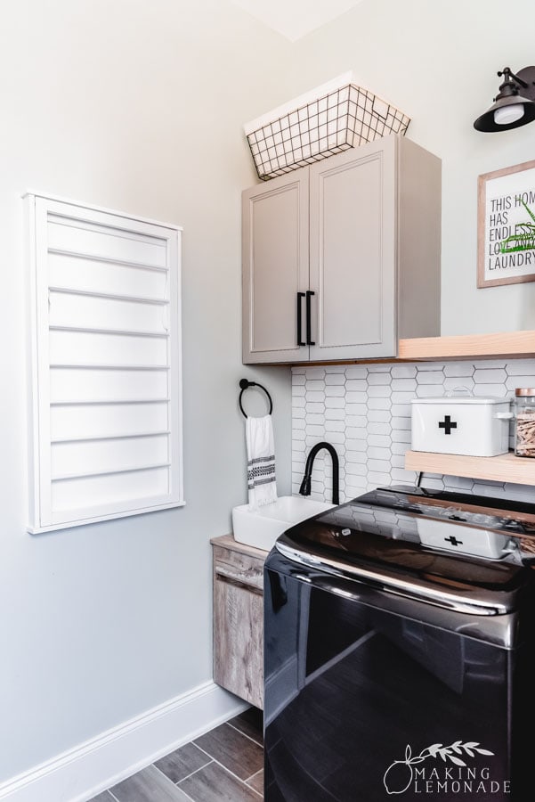 small laundry room with drying rack