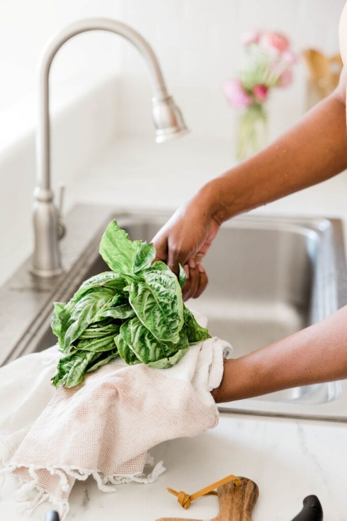meal prepping washing veggies