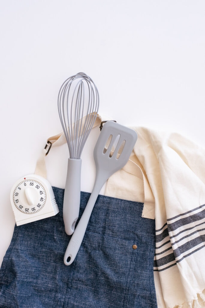 apron with baking utensils for meal planning