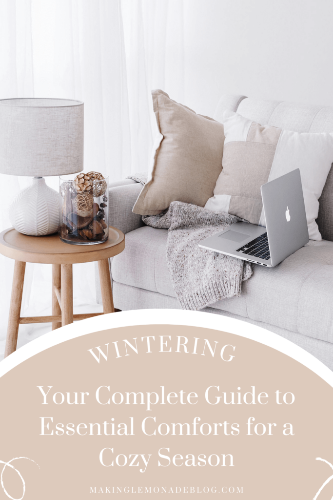 computer on couch with text that says 'wintering: your complete guide to essential comforts for a cozy season'